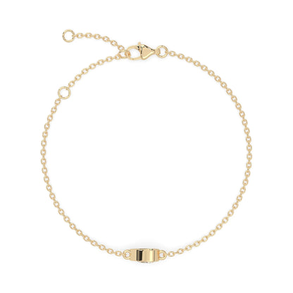 Pear cut lab grown diamond bezel set solitaire bracelet with delicate chain and lobster clasp in yellow gold tone.