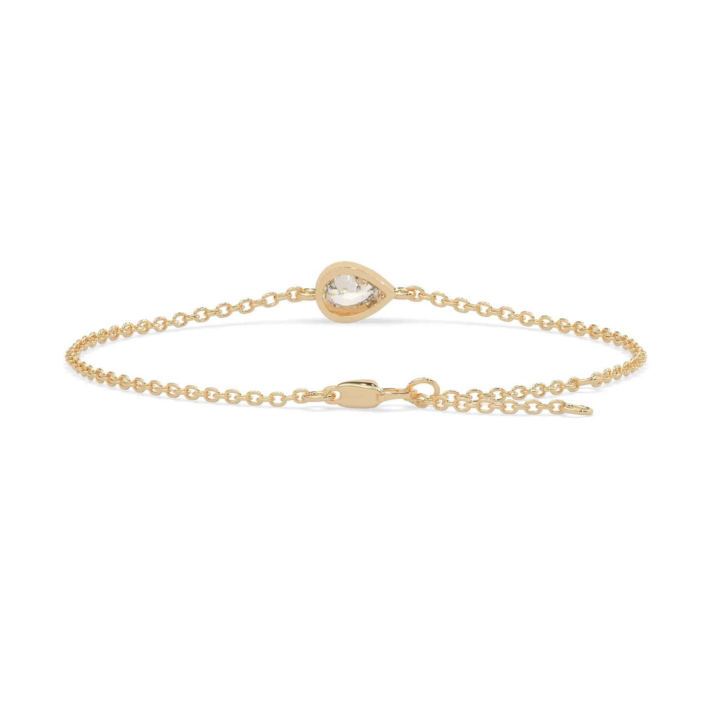 Pear cut lab grown diamond bezel set solitaire bracelet with delicate chain and lobster clasp in yellow gold tone.