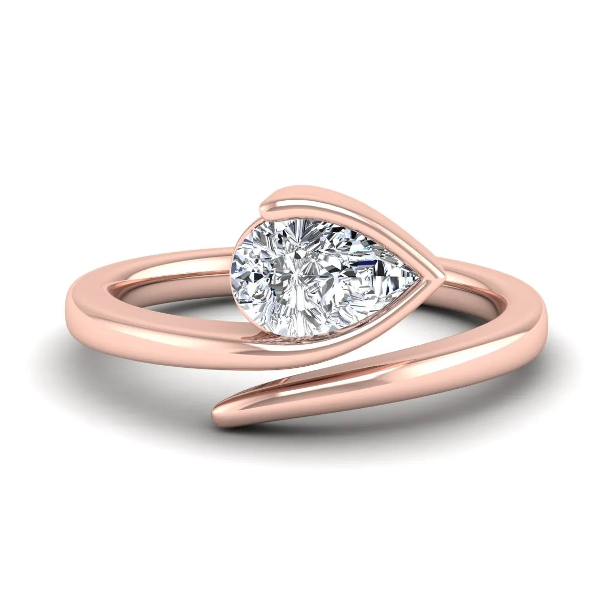 Pear cut lab grown diamond bypass engagement ring featuring a 1.00 carat IGI certified diamond in a modern partial bezel setting with a rose gold design.
