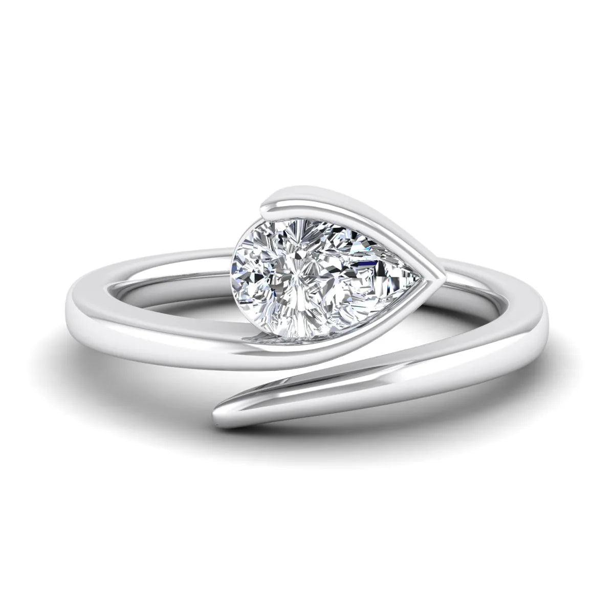 Pear cut lab grown diamond bypass engagement ring featuring a 1.00 carat IGI certified diamond in a modern partial bezel setting with a white gold design.