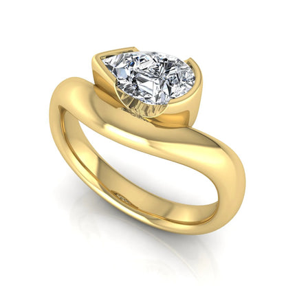 Pear cut lab grown diamond bezel set solitaire engagement ring in yellow gold tone