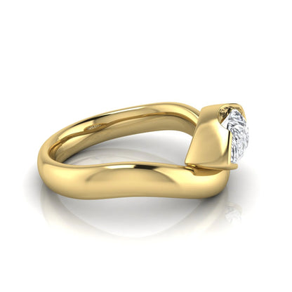 Pear cut lab grown diamond bezel set solitaire engagement ring in yellow gold tone