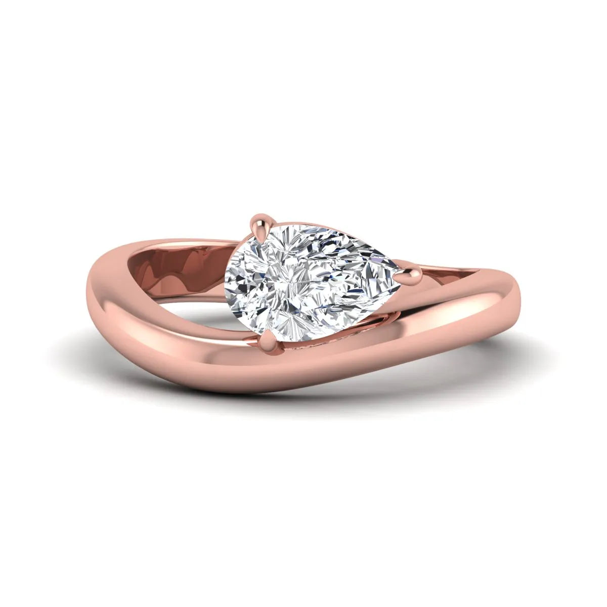 Pear cut lab grown diamond curved solitaire engagement ring with a four-prong setting in rose gold