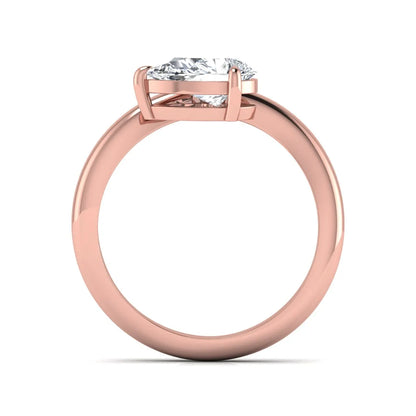 Pear cut lab grown diamond curved solitaire engagement ring with a four-prong setting in rose gold
