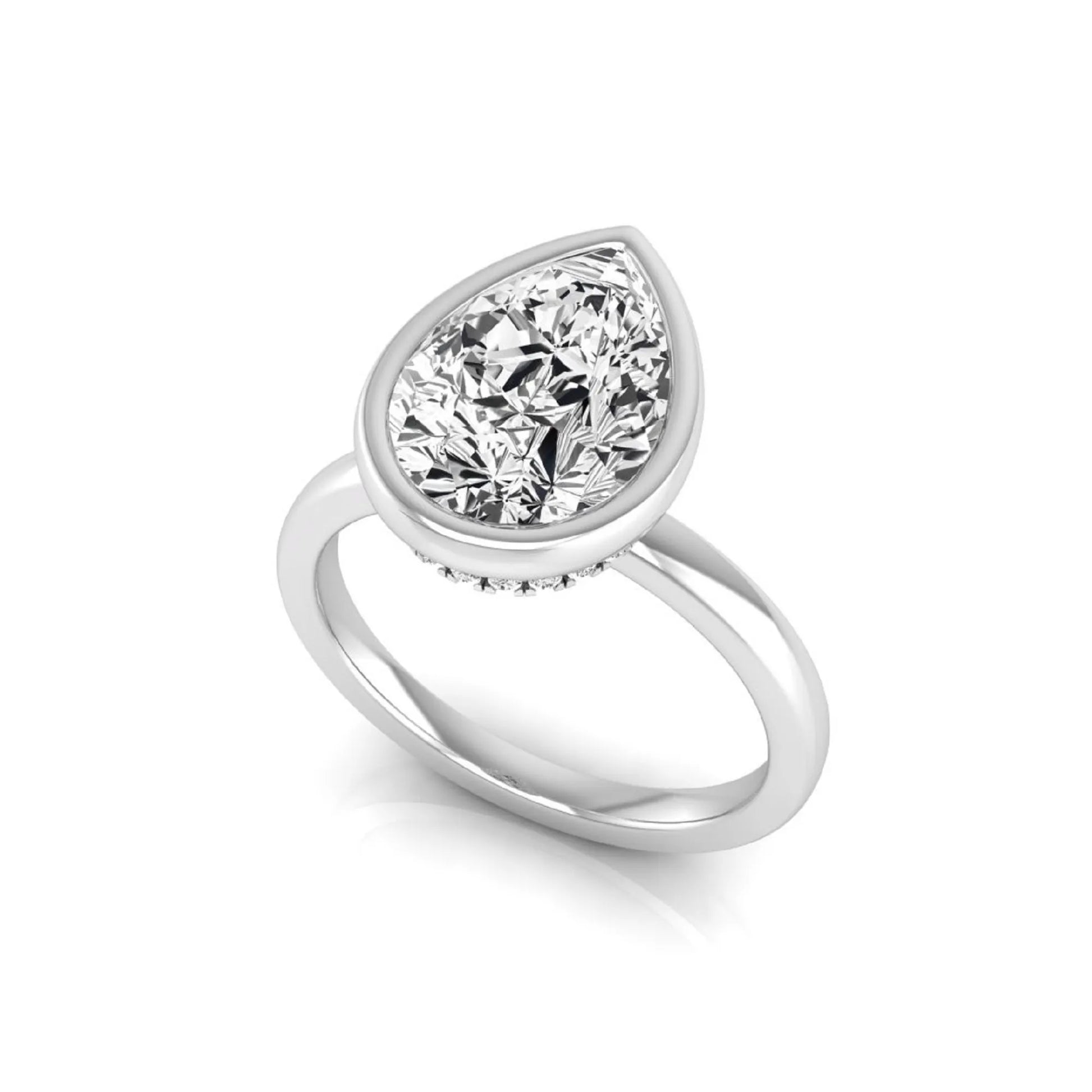 Pear cut lab grown diamond engagement ring featuring a 1.80 carat IGI certified diamond in a bezel setting with a hidden halo of round diamonds on a white gold band.