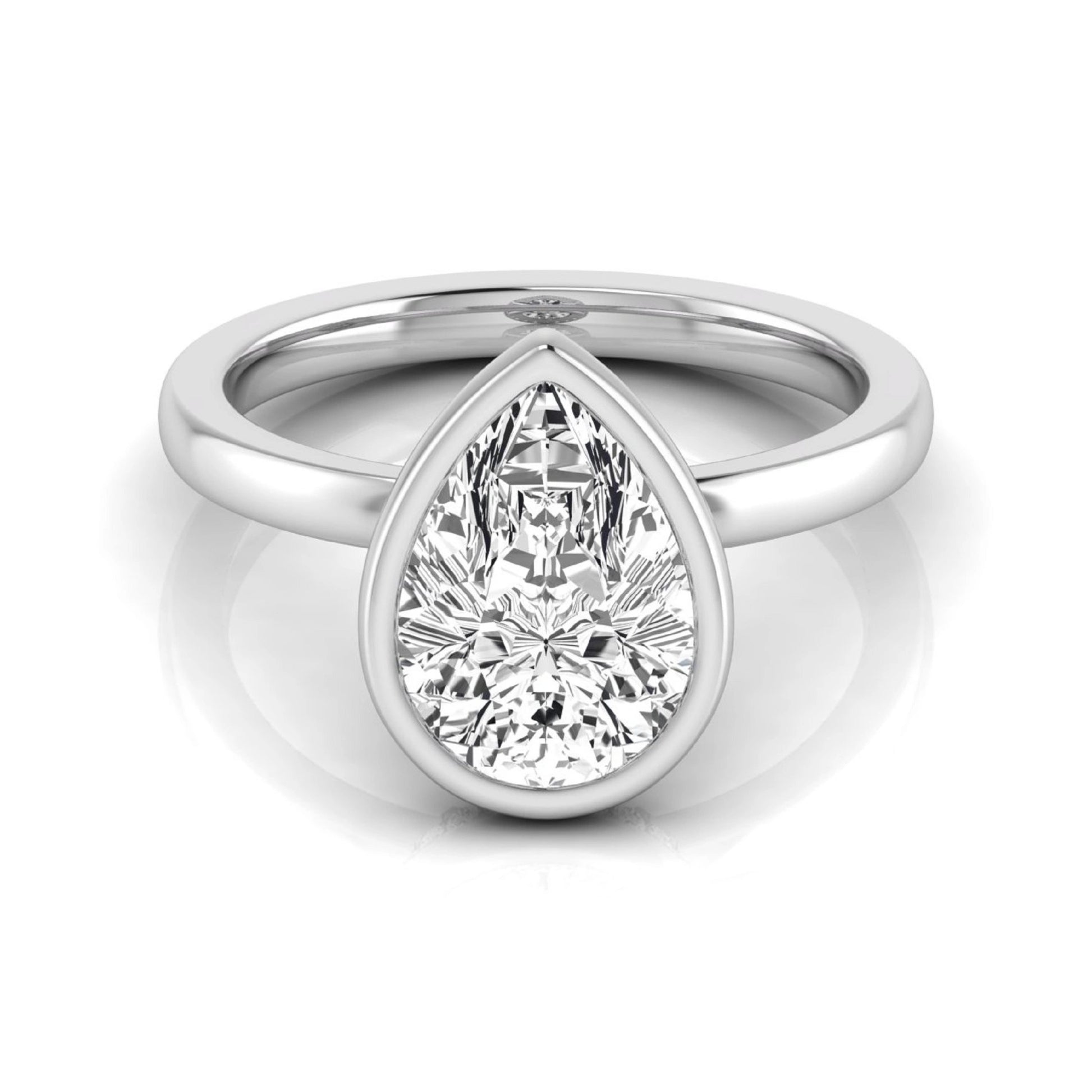 Pear cut lab grown diamond engagement ring featuring a 1.80 carat IGI certified diamond in a bezel setting with a hidden halo of round diamonds on a white gold band.