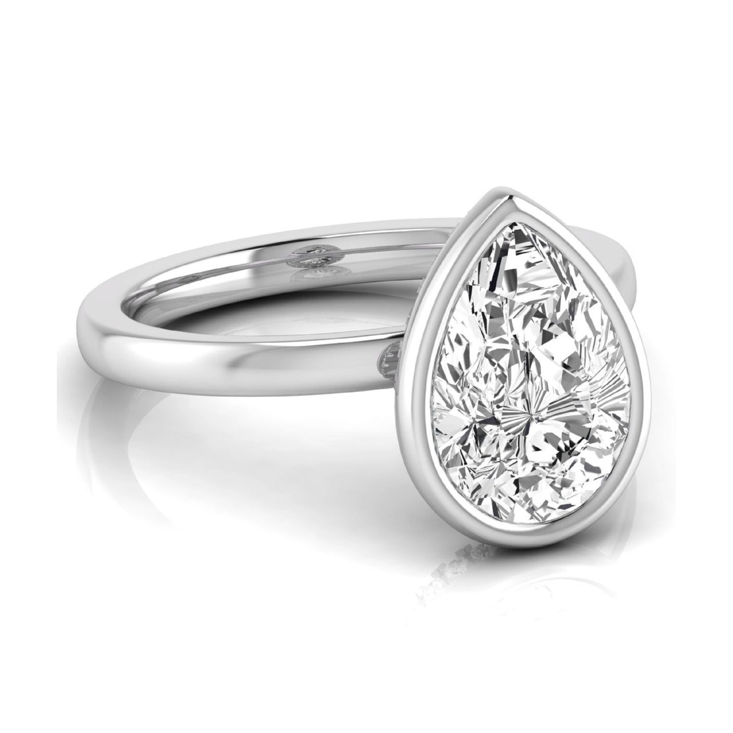 Pear cut lab grown diamond engagement ring featuring a 1.80 carat IGI certified diamond in a bezel setting with a hidden halo of round diamonds on a white gold band.