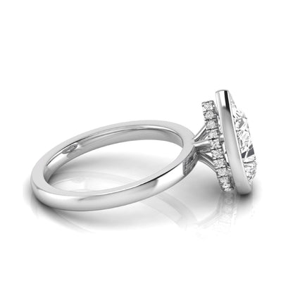 Pear cut lab grown diamond engagement ring featuring a 1.80 carat IGI certified diamond in a bezel setting with a hidden halo of round diamonds on a white gold band.