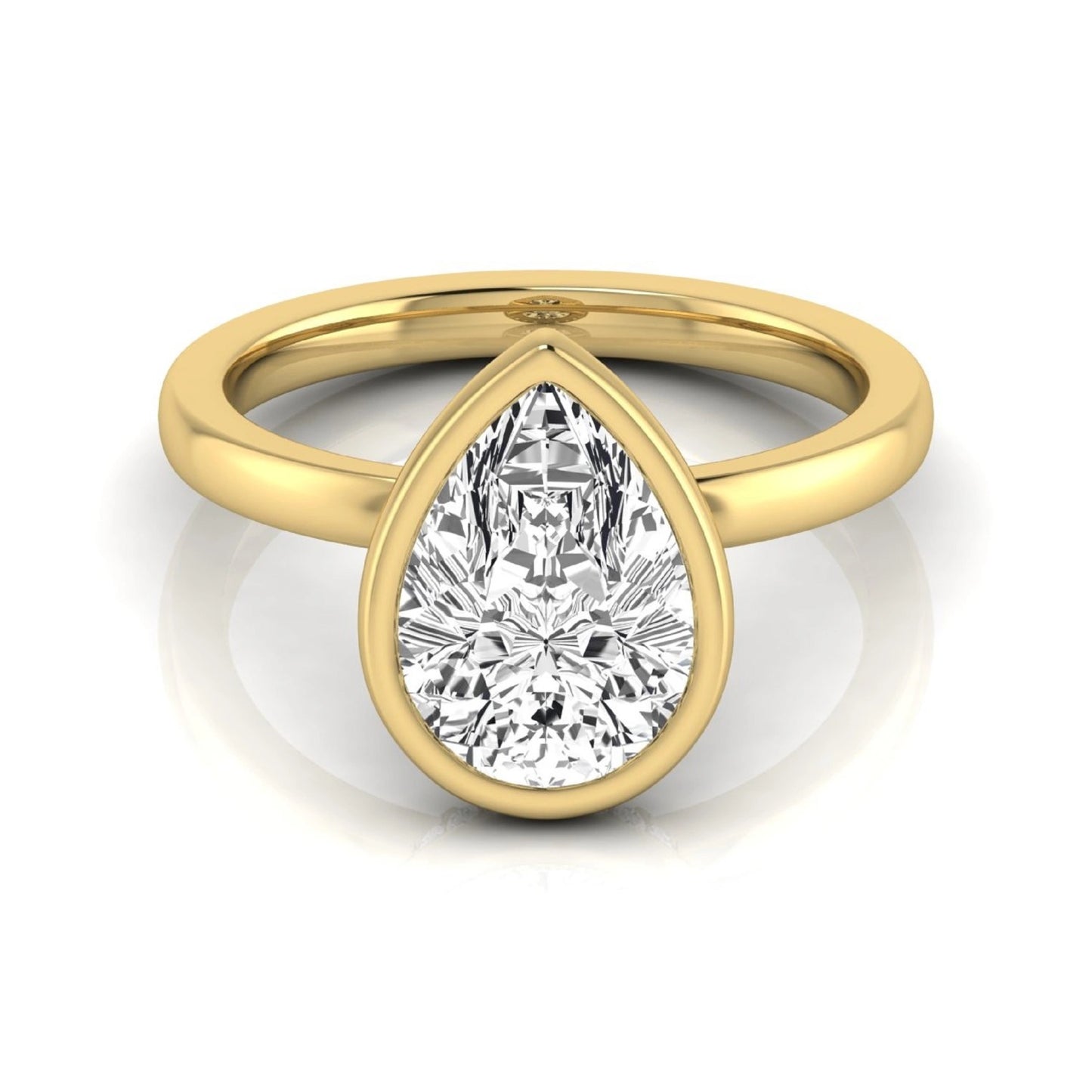 Pear cut lab grown diamond engagement ring featuring a 1.80 carat IGI certified diamond in a bezel setting with a hidden halo of round diamonds on a yellow gold band.