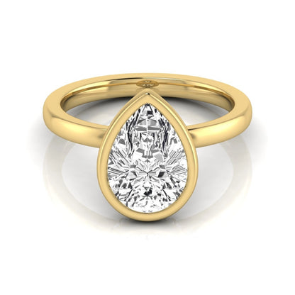 Pear cut lab grown diamond engagement ring featuring a 1.80 carat IGI certified diamond in a bezel setting with a hidden halo of round diamonds on a yellow gold band.