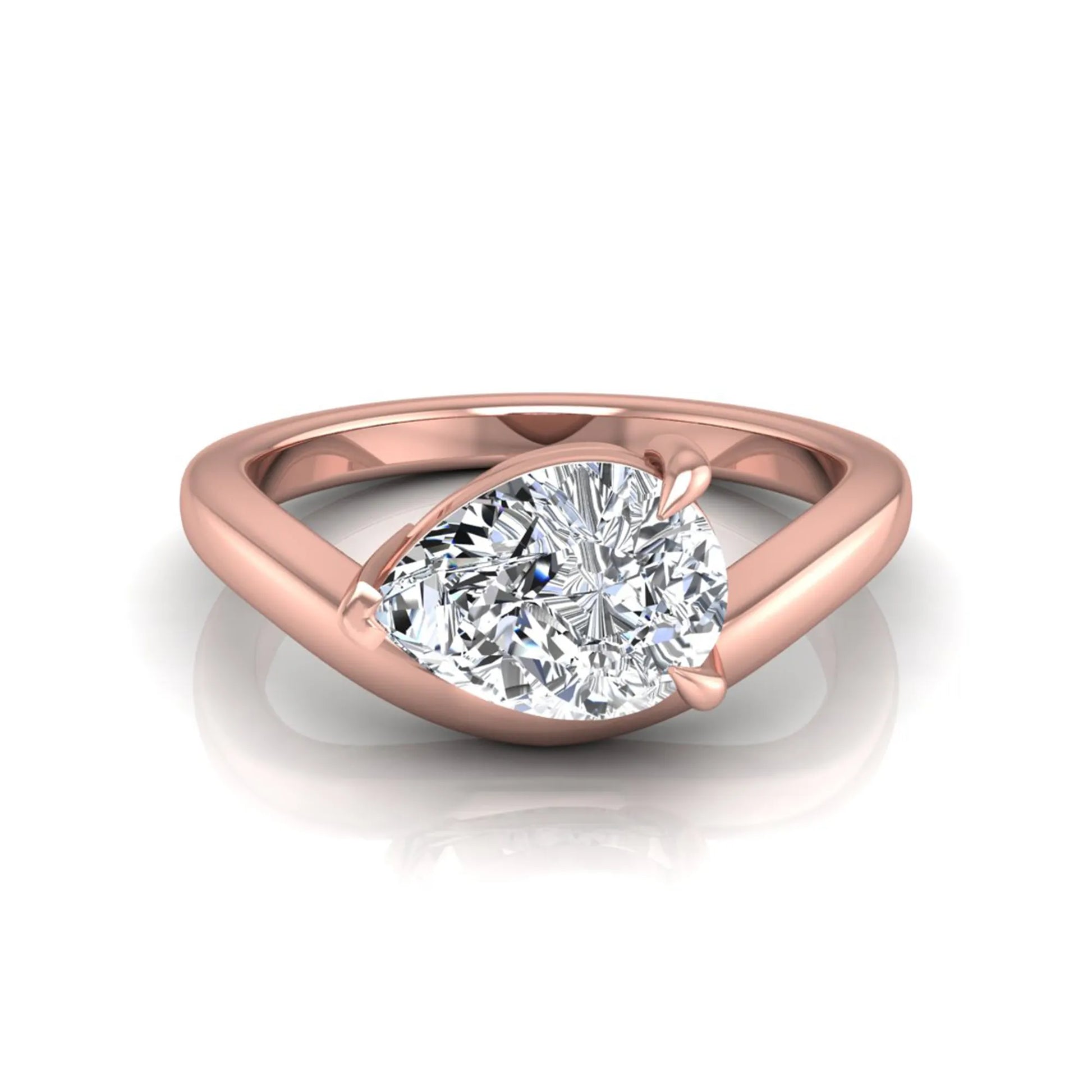 Pear cut lab grown diamond curved solitaire engagement ring in rose gold with a sculpted curved band and IGI certified center diamond.