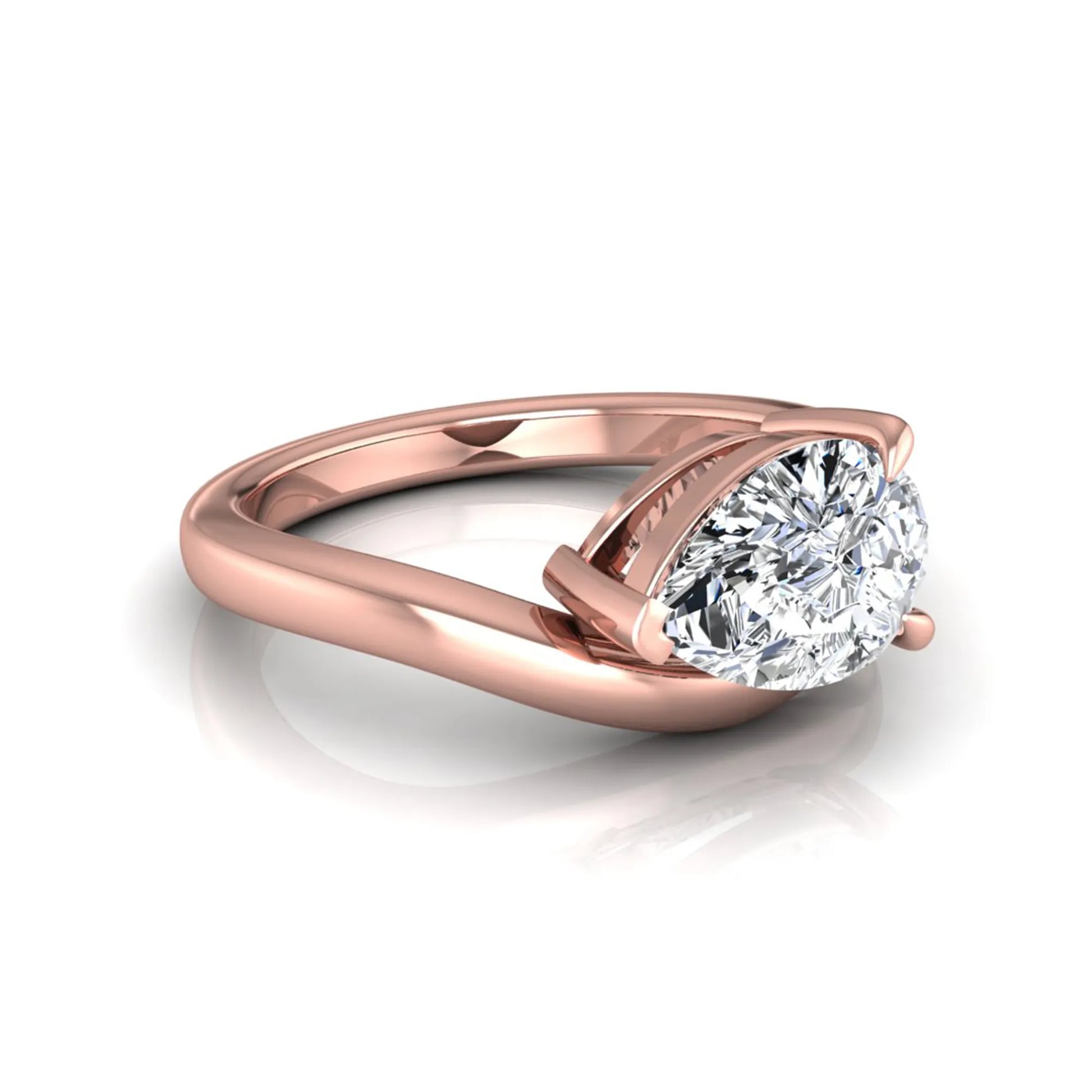 Pear cut lab grown diamond curved solitaire engagement ring in rose gold with a sculpted curved band and IGI certified center diamond.