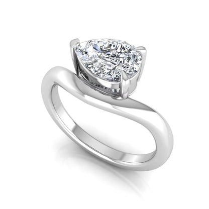 Pear cut lab grown diamond curved solitaire engagement ring in white gold with a sculpted curved band and IGI certified center diamond.