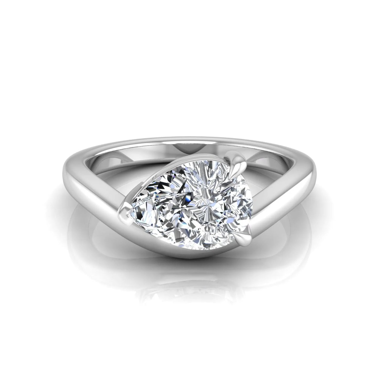 Pear cut lab grown diamond curved solitaire engagement ring in white gold with a sculpted curved band and IGI certified center diamond.