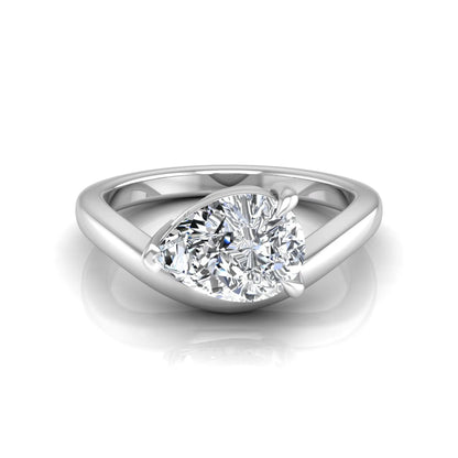 Pear cut lab grown diamond curved solitaire engagement ring in white gold with a sculpted curved band and IGI certified center diamond.