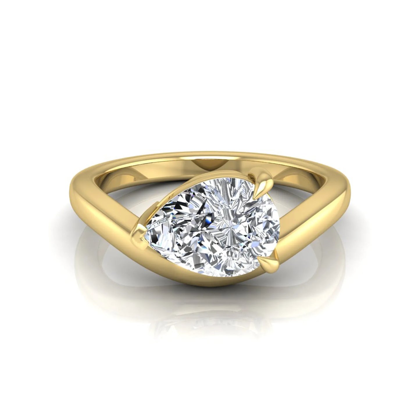 Pear cut lab grown diamond curved solitaire engagement ring in yellow gold with a sculpted curved band and IGI certified center diamond.