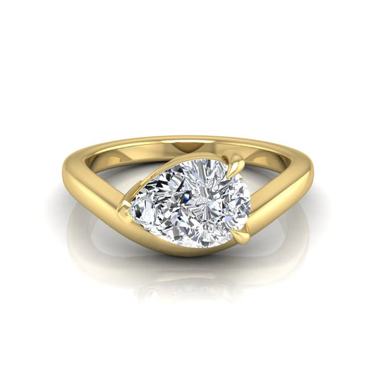 Pear cut lab grown diamond curved solitaire engagement ring in yellow gold with a sculpted curved band and IGI certified center diamond.