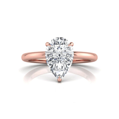 rose gold 3 carat pear cut lab grown diamond solitaire engagement ring featuring an IGI certified center diamond in a classic three-prong setting.