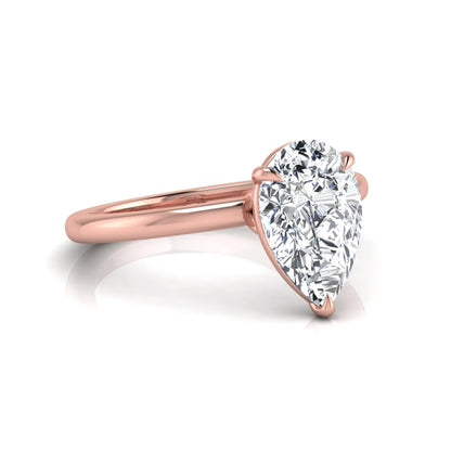 rose gold 3 carat pear cut lab grown diamond solitaire engagement ring featuring an IGI certified center diamond in a classic three-prong setting.
