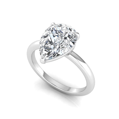 white gold 3 carat pear cut lab grown diamond solitaire engagement ring featuring an IGI certified center diamond in a classic three-prong setting.