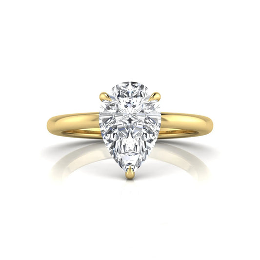 yellow gold 3 carat pear cut lab grown diamond solitaire engagement ring featuring an IGI certified center diamond in a classic three-prong setting.