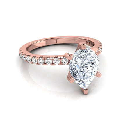 Pear cut lab grown diamond solitaire engagement ring with pavé side diamonds in rose gold featuring a 1.75 carat IGI certified center diamond.