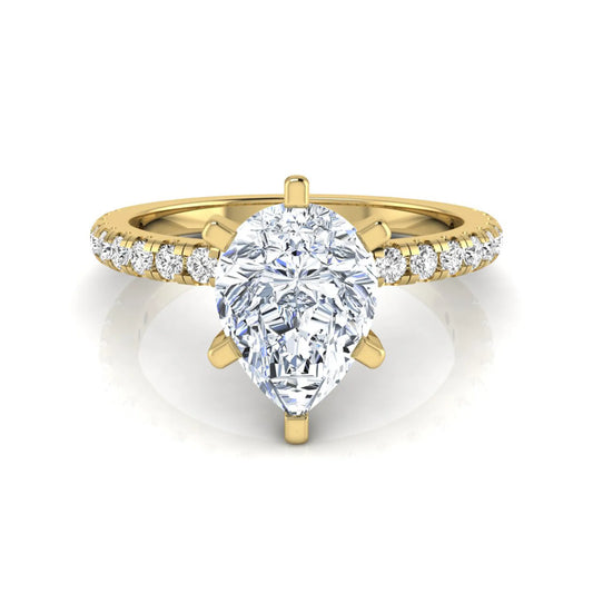 Pear cut lab grown diamond solitaire engagement ring with pavé side diamonds in yellow gold featuring a 1.75 carat IGI certified center diamond.