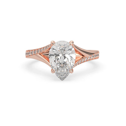 Pear cut lab grown diamond split shank engagement ring with diamond accented band in rose gold