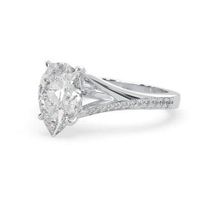 Pear cut lab grown diamond split shank engagement ring with diamond accented band in white gold