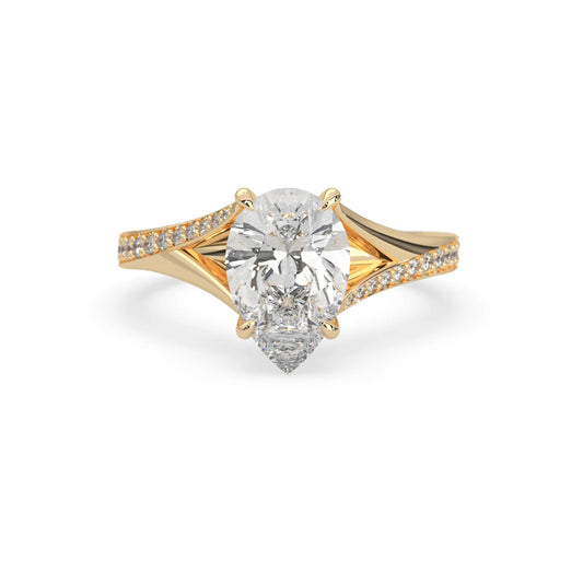 Pear cut lab grown diamond split shank engagement ring with diamond accented band in yellow gold