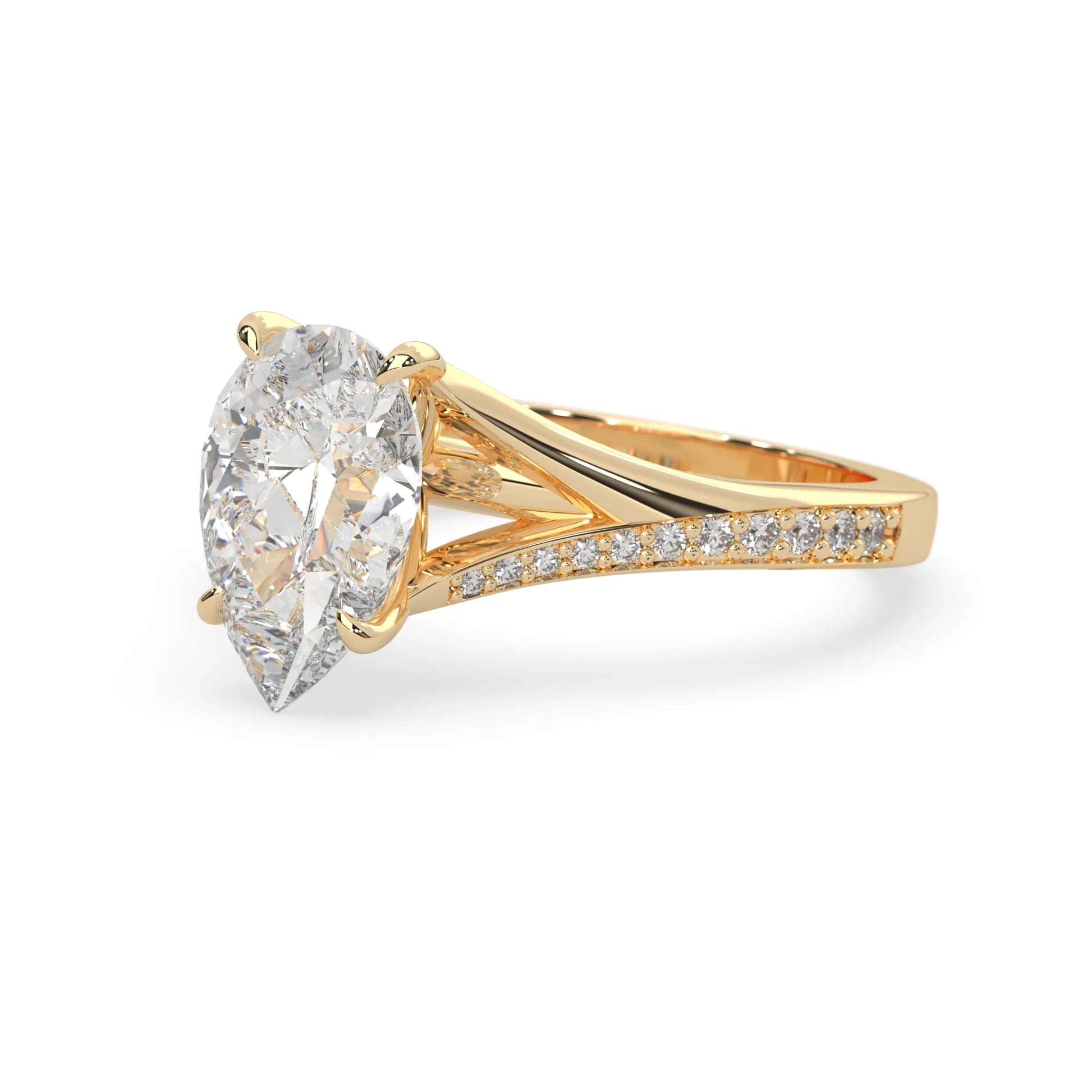 Pear cut lab grown diamond split shank engagement ring with diamond accented band in yellow gold