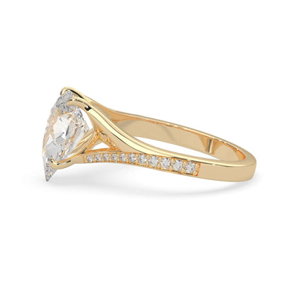 Pear cut lab grown diamond split shank engagement ring with diamond accented band in yellow gold