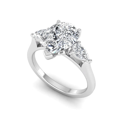 IGI certified pear cut lab grown diamond three stone engagement ring with pear side diamonds in white gold.