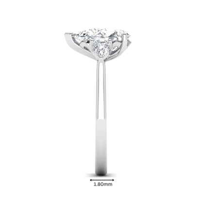 IGI certified pear cut lab grown diamond three stone engagement ring with pear side diamonds in white gold.