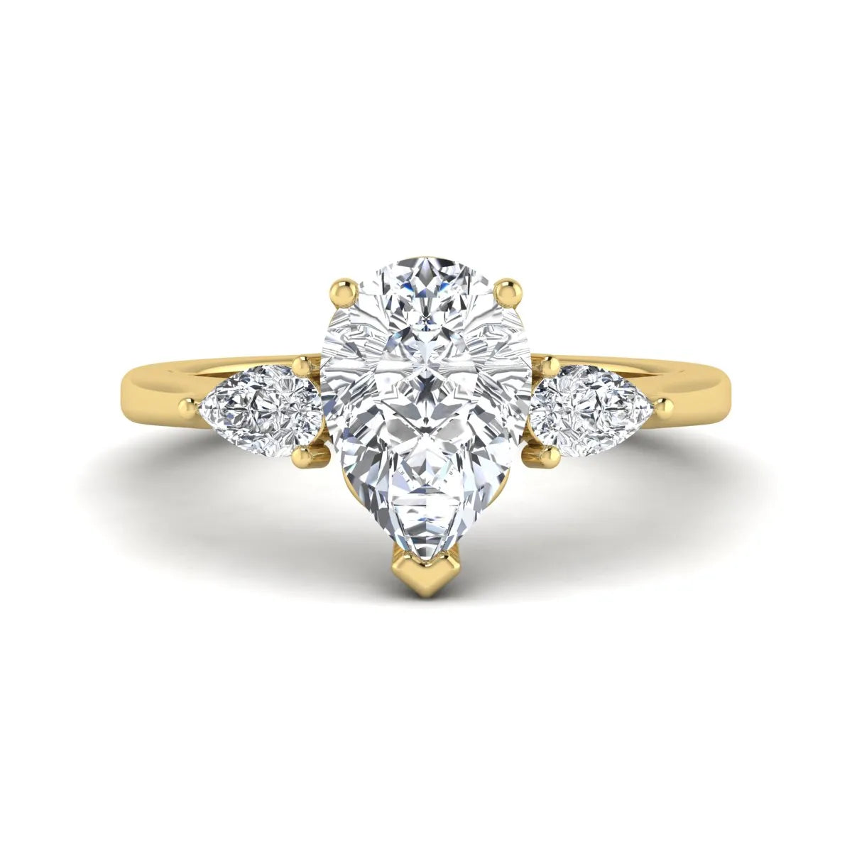 IGI certified pear cut lab grown diamond three stone engagement ring with pear side diamonds in yellow gold.