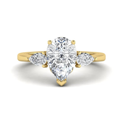 IGI certified pear cut lab grown diamond three stone engagement ring with pear side diamonds in yellow gold.