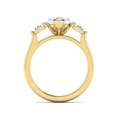 IGI certified pear cut lab grown diamond three stone engagement ring with pear side diamonds in yellow gold.