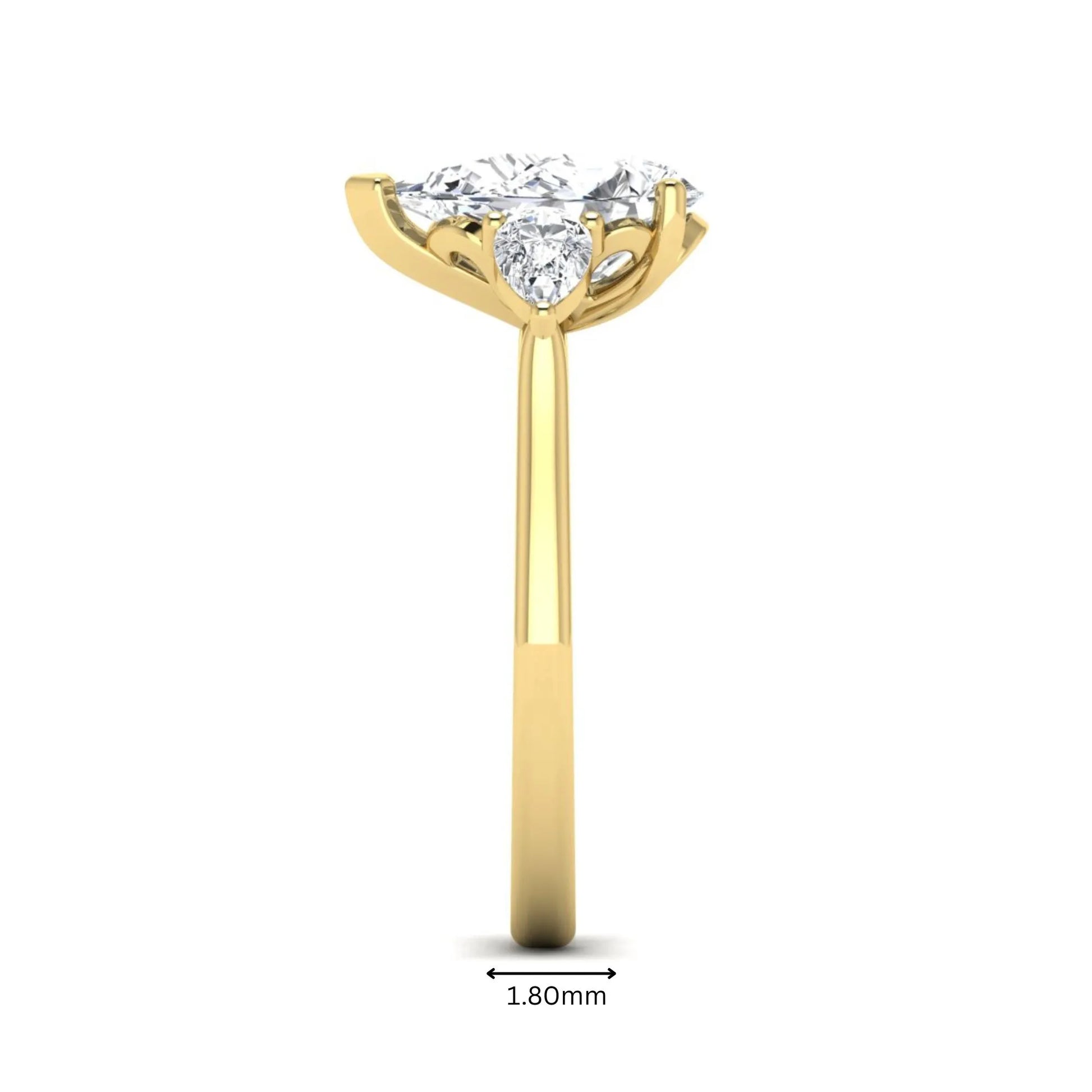IGI certified pear cut lab grown diamond three stone engagement ring with pear side diamonds in yellow gold.
