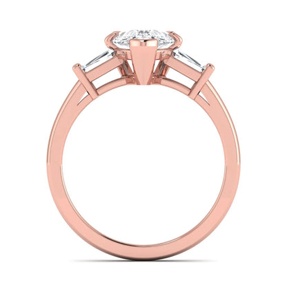 Pear cut lab grown diamond three stone engagement ring featuring a 2.31 carat IGI certified center diamond with tapered baguette side diamonds in rose gold.