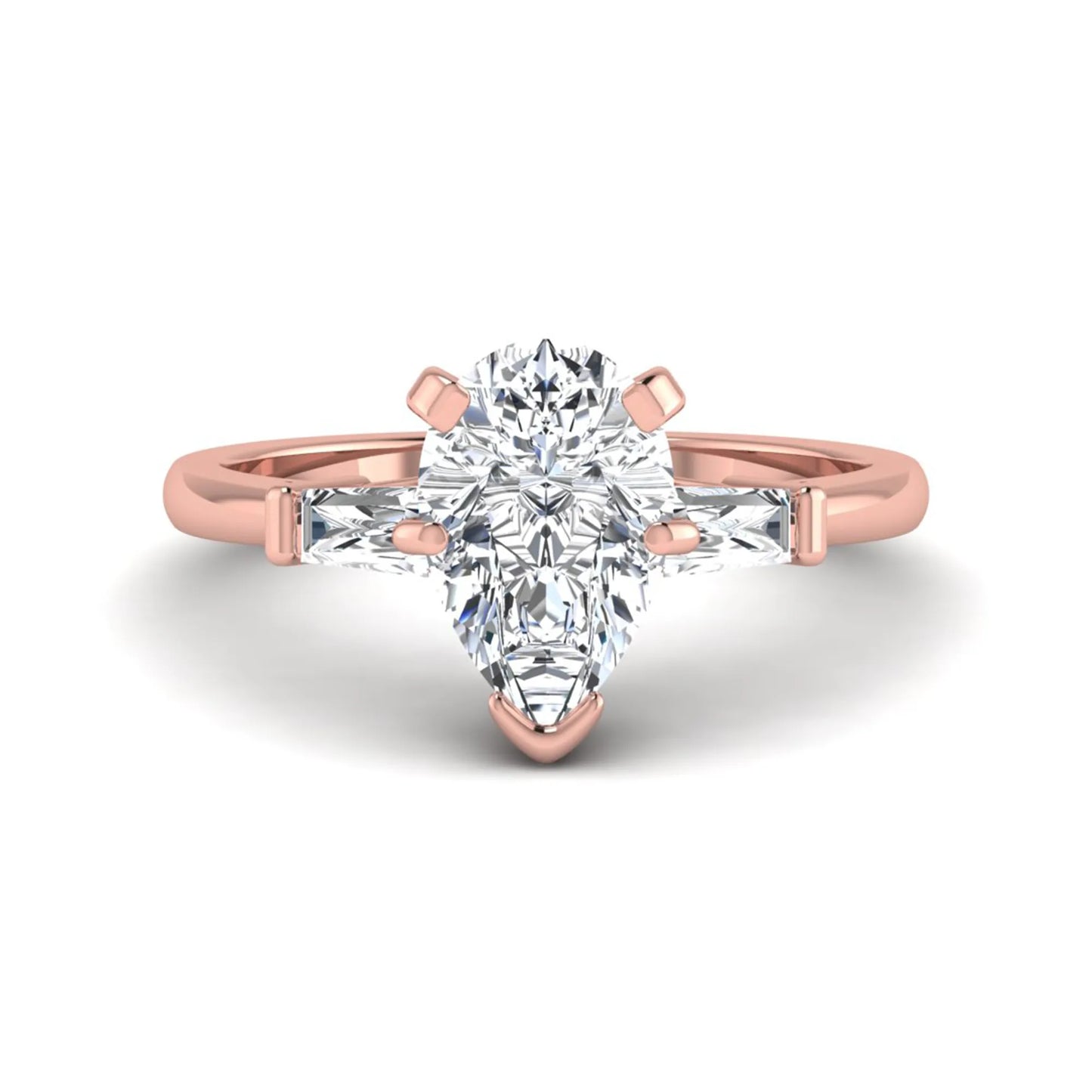 Pear cut lab grown diamond three stone engagement ring featuring a 2.31 carat IGI certified center diamond with tapered baguette side diamonds in rose gold.