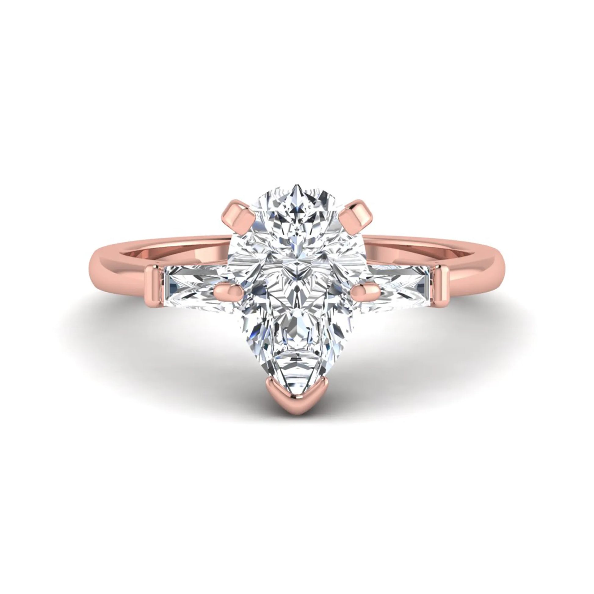 Pear cut lab grown diamond three stone engagement ring featuring a 2.31 carat IGI certified center diamond with tapered baguette side diamonds in rose gold.