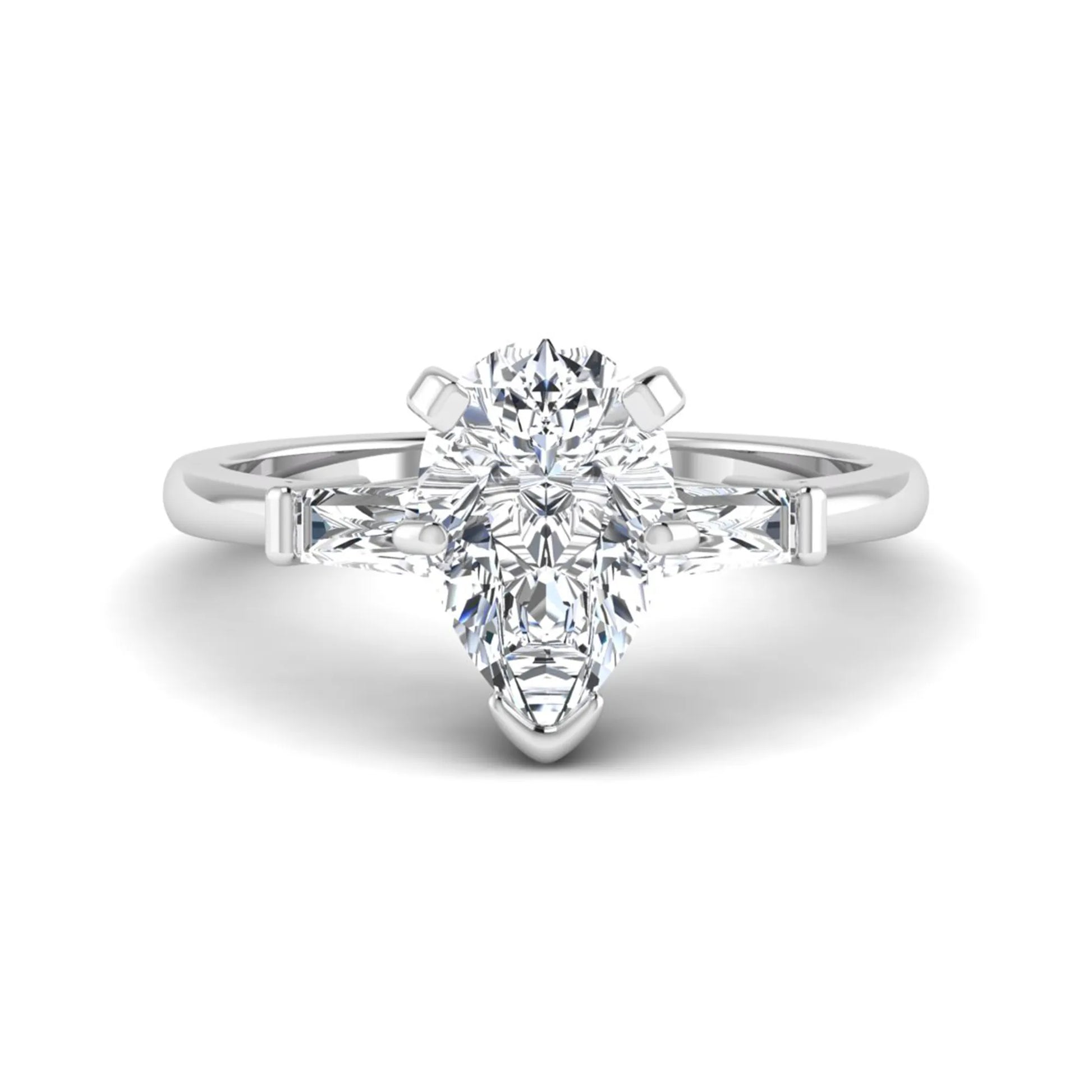 Pear cut lab grown diamond three stone engagement ring featuring a 2.31 carat IGI certified center diamond with tapered baguette side diamonds in white gold.