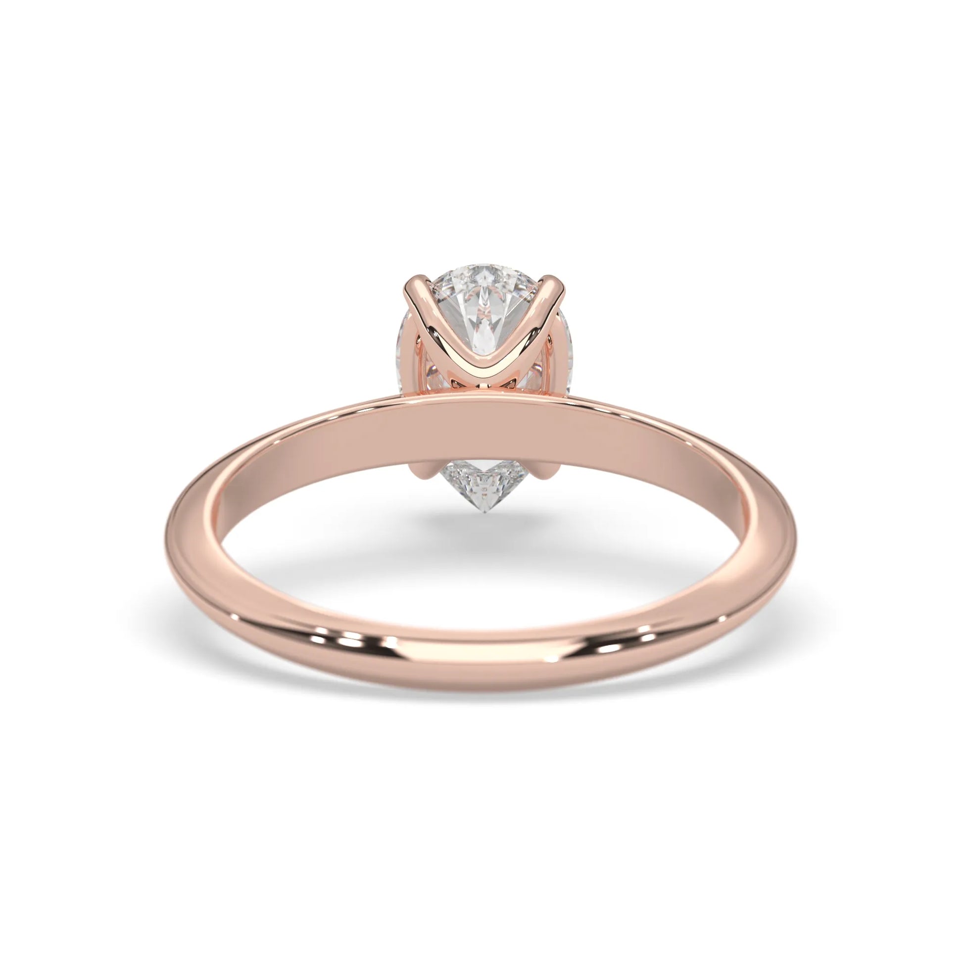 Rose-gold ring with a diamond on a white background