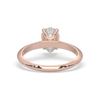 Rose-gold ring with a diamond on a white background