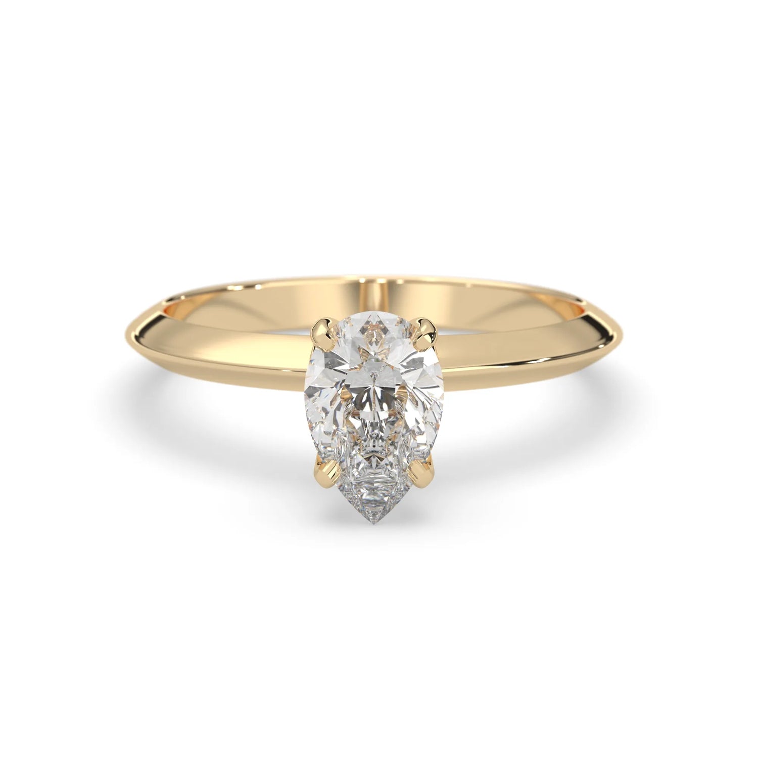yellow-Gold ring with a pear-shaped diamond on a white background