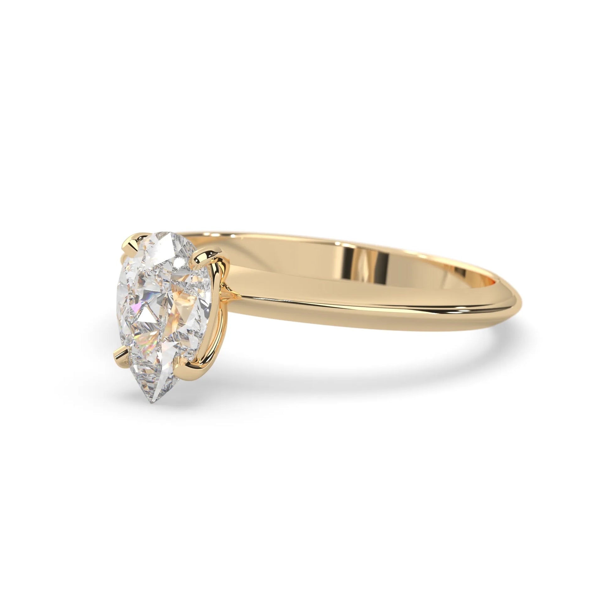 yellow-Gold ring with a pear-shaped diamond on a white background