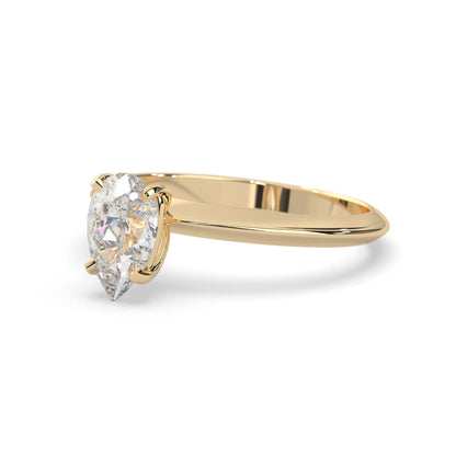 yellow-Gold ring with a pear-shaped diamond on a white background