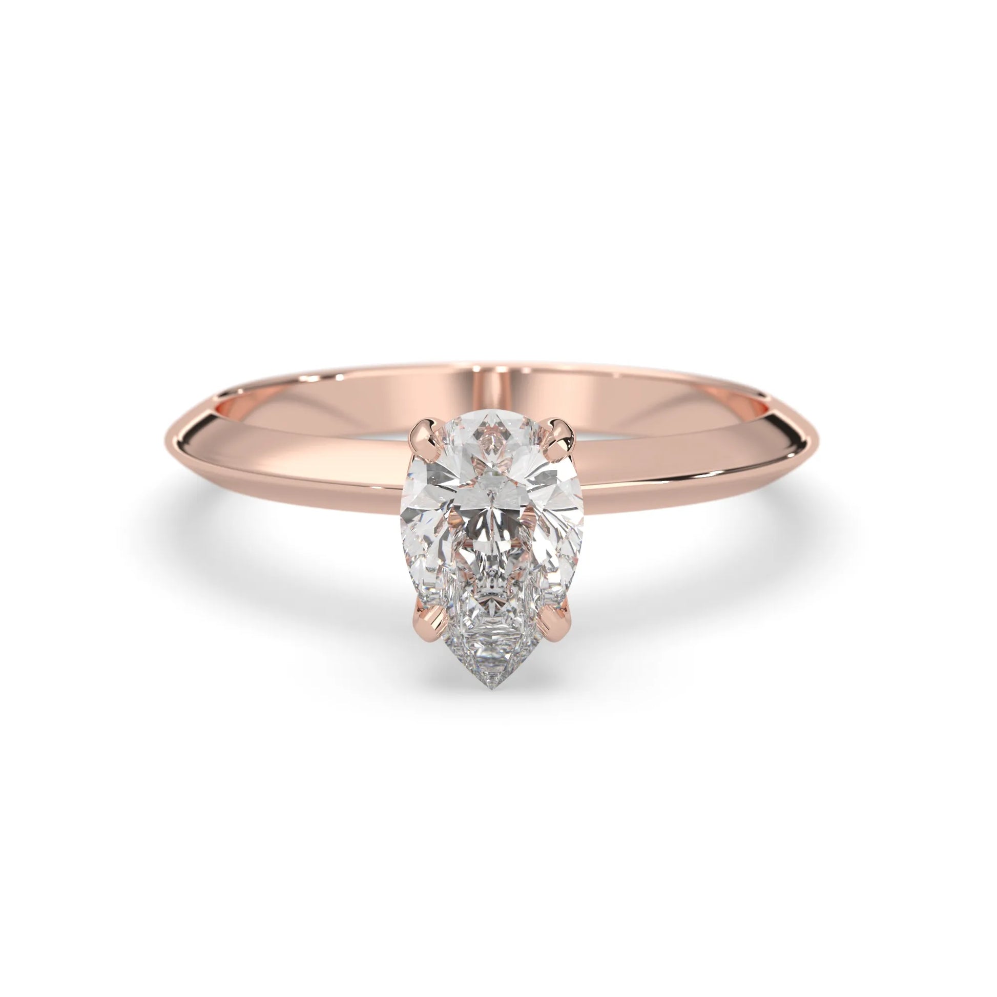 Rose-gold ring with a pear-shaped diamond on a white background