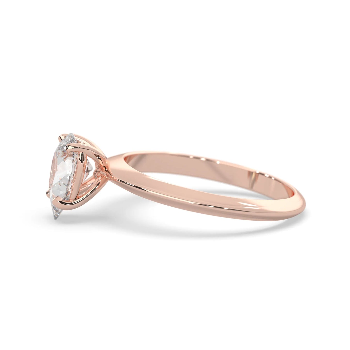 Rose-gold ring with a clear gemstone on a white background