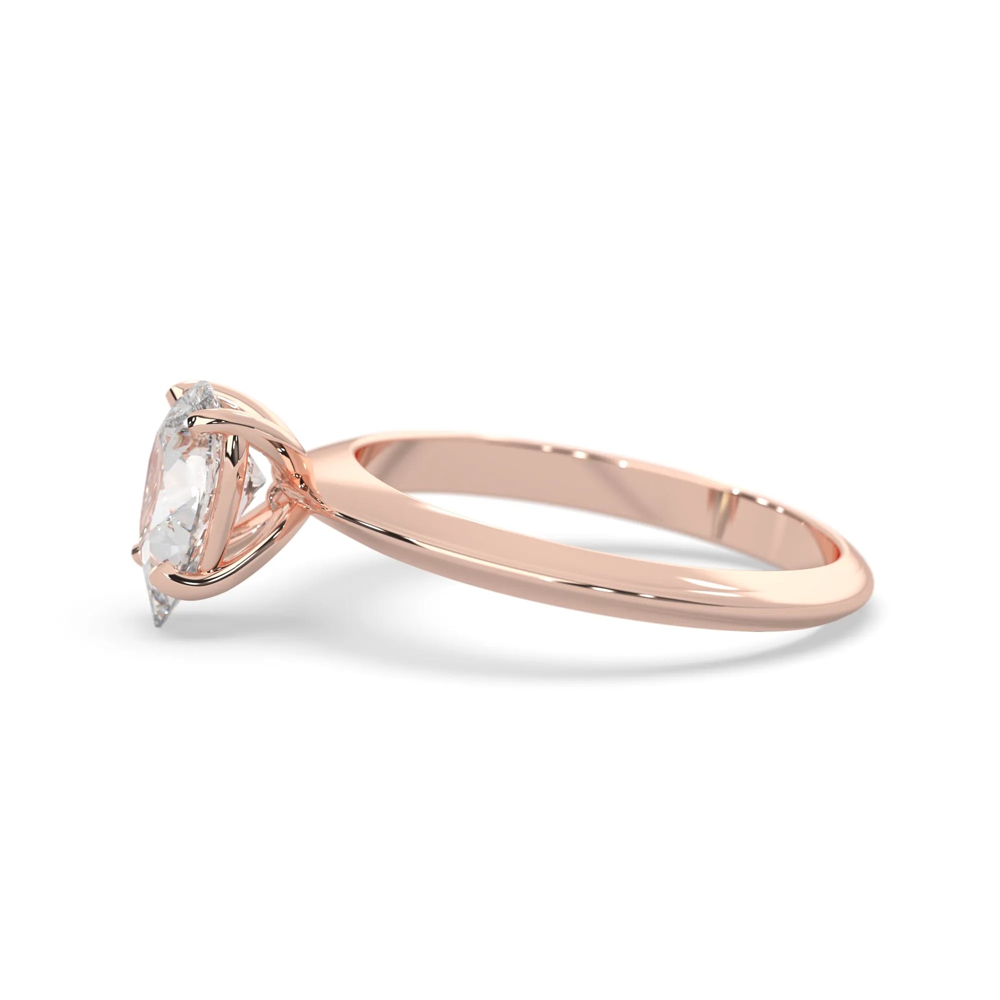Rose-gold ring with a clear gemstone on a white background